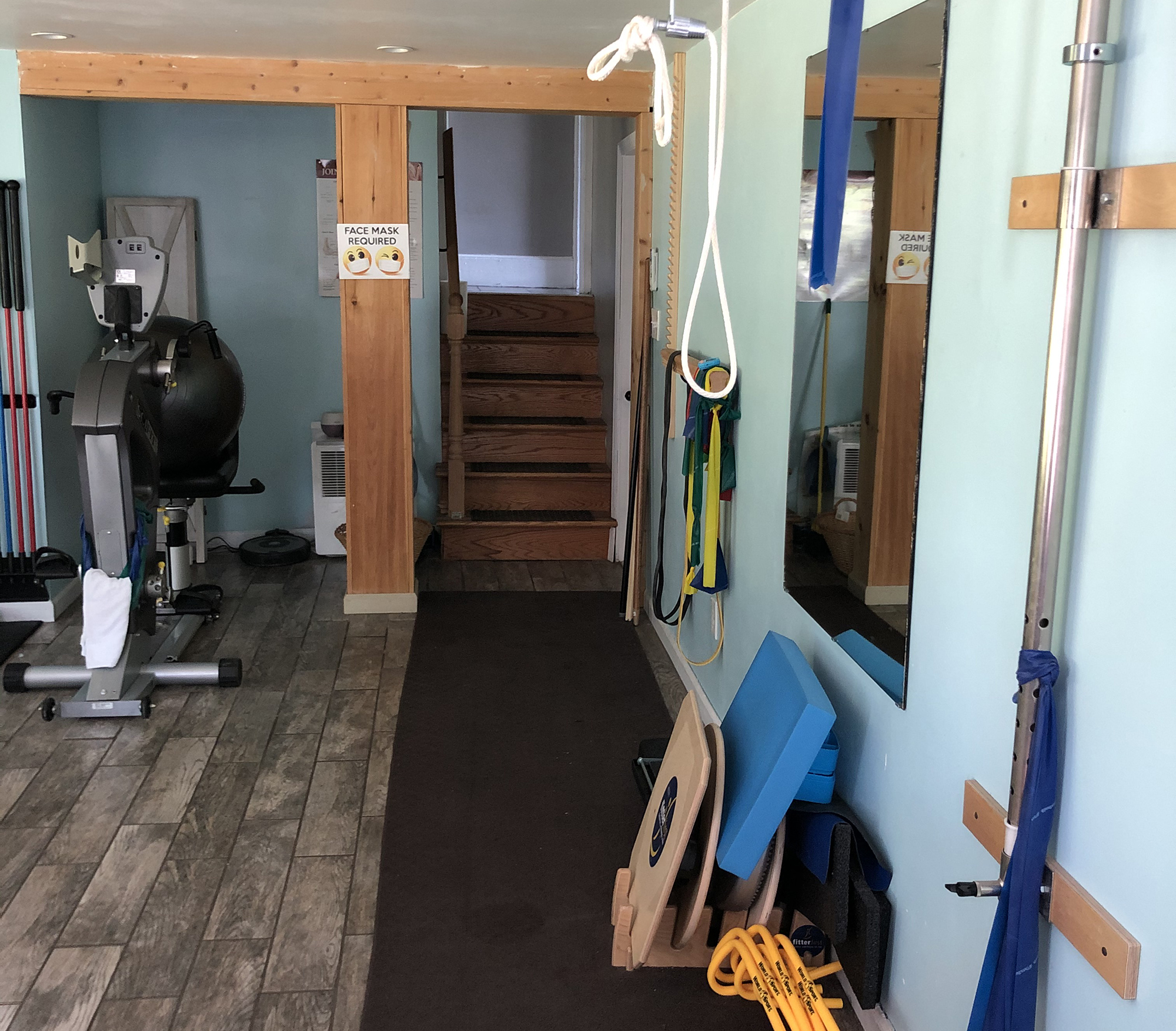 The physical therapy studio showing an bike and equipment