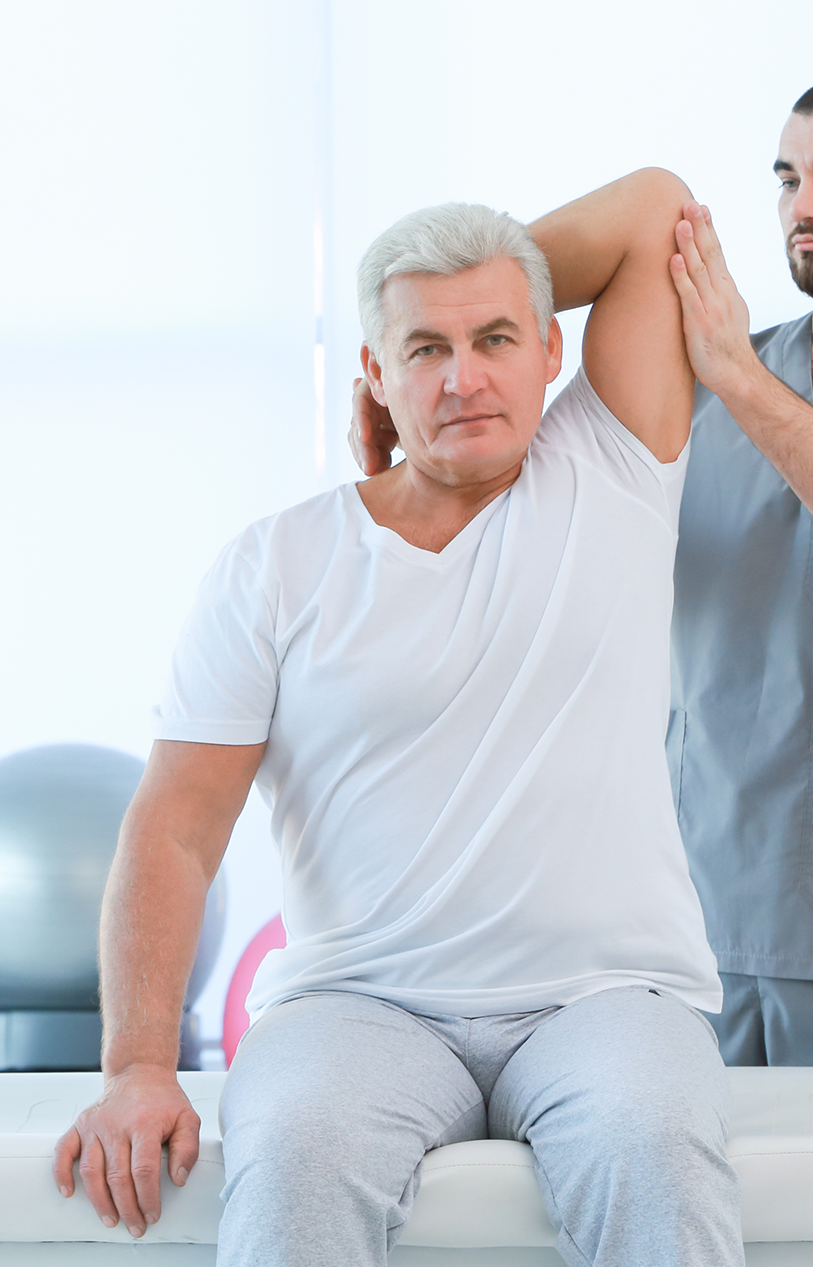 Physical Therapist working with elderly patient